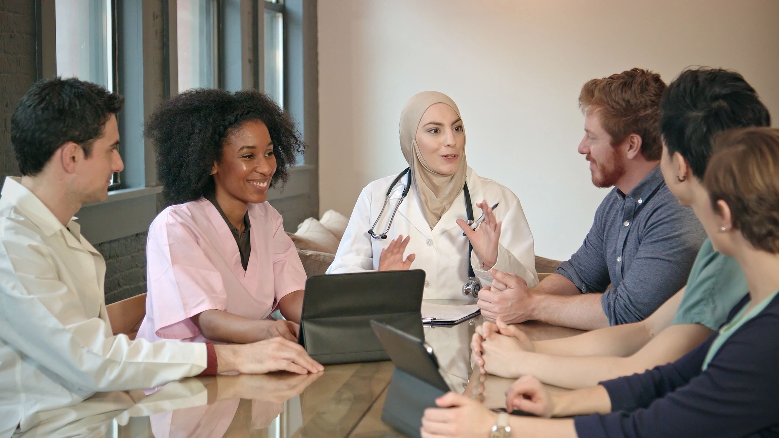 Healthcare team reviewing performance data in a modern clinic office